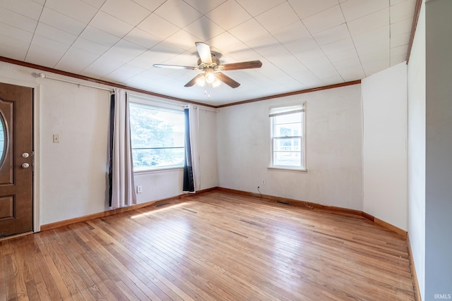 208 Chestnut St, Avilla, IN 46710 - entrance foyer with light wood-type flooring, a ceiling fan, and ornamental molding