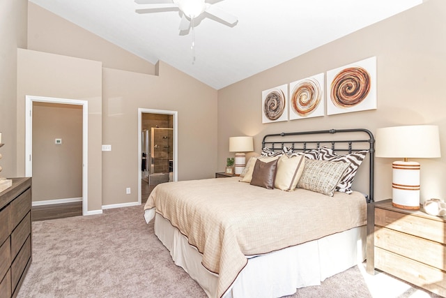 2057 Abbey Ln, Columbus, IN 47201 - bedroom with vaulted ceiling, light colored carpet, ensuite bath, and ceiling fan