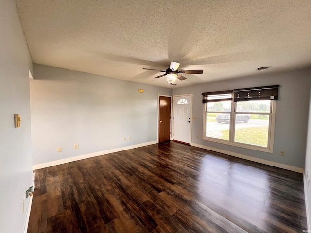 3563 County Road 40a, Auburn, IN 46706 - empty room with ceiling fan, dark wood-style floors, and a textured ceiling