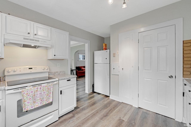 4643 Calumet Ave, Fort Wayne, IN 46806 - kitchen featuring white appliances, under cabinet range hood, light countertops, and light wood-type flooring
