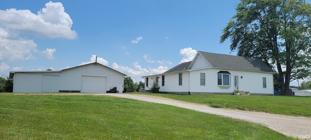6638 N 1000 W, Jasonville, IN 47438 - view of front of home featuring dirt driveway, an outdoor structure, and a front yard