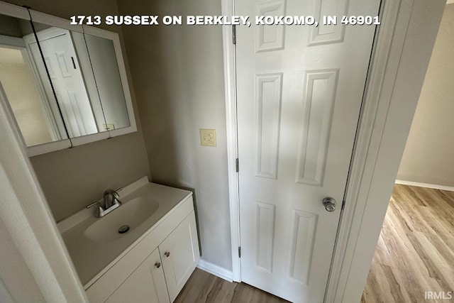 1410 Dunham On Berkley, Kokomo, IN 46901 - bathroom featuring wood finished floors and vanity