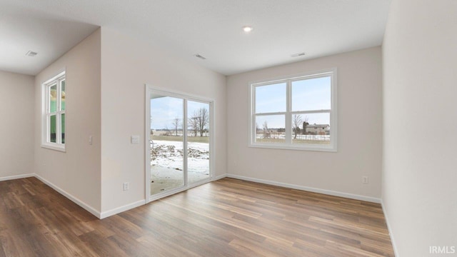 5103 Buffay Ct, New Haven, IN 46774 - spare room with wood finished floors, healthy amount of natural light, and recessed lighting