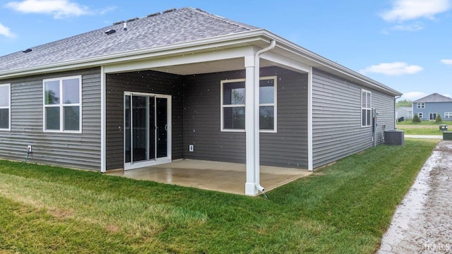 5103 Buffay Ct, New Haven, IN 46774 - rear view of house with a patio, a lawn, and roof with shingles
