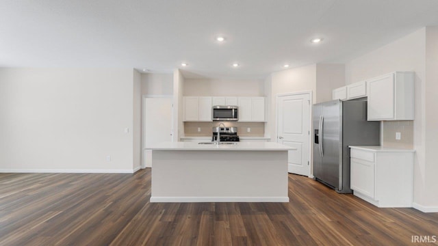 5103 Buffay Ct, New Haven, IN 46774 - kitchen with stainless steel appliances, decorative backsplash, light countertops, a center island with sink, and white cabinets