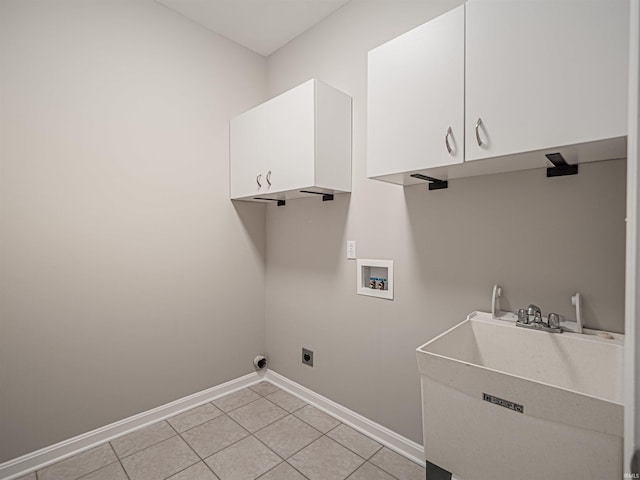 2601 Greatway Ct, Evansville, IN 47711 - washroom featuring hookup for a washing machine, cabinet space, electric dryer hookup, and light tile patterned flooring