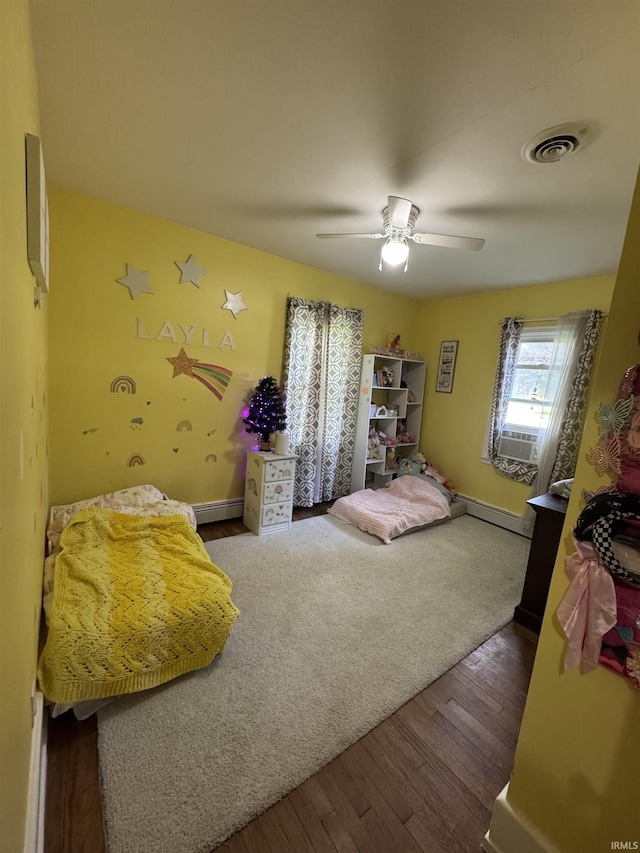 1533 E Paw Paw Pike, Peru, IN 46970 - bedroom with wood finished floors, ceiling fan, and cooling unit