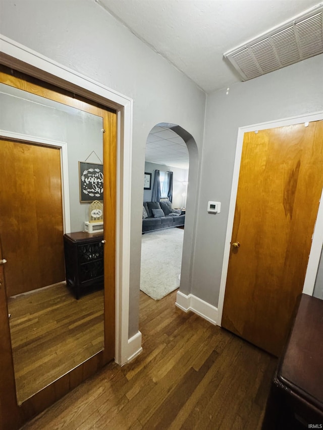 1533 E Paw Paw Pike, Peru, IN 46970 - hallway featuring arched walkways and dark wood finished floors