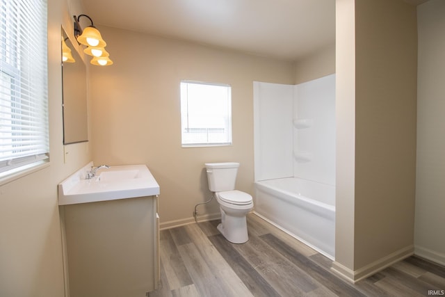 1210 W Hickory St, Union City, IN 47390 - bathroom featuring healthy amount of natural light, vanity, wood finished floors, and shower / bath combination