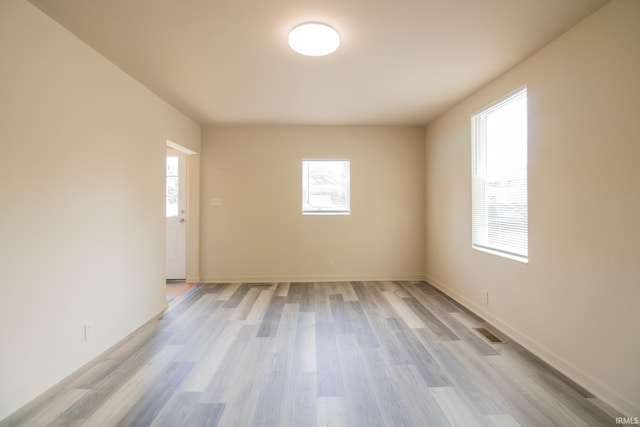 1210 W Hickory St, Union City, IN 47390 - empty room with light wood-type flooring and baseboards