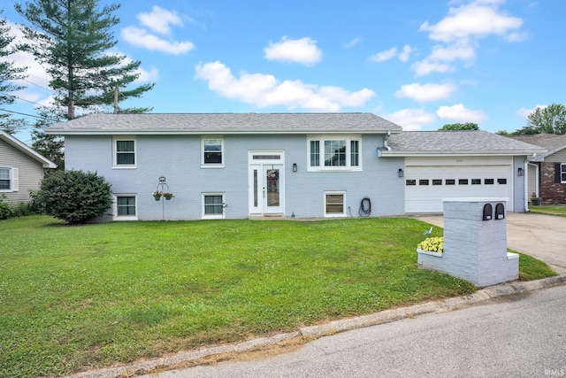 1803 Linwood Dr, Bedford, IN 47421 - split foyer home featuring a garage, driveway, a front yard, and brick siding