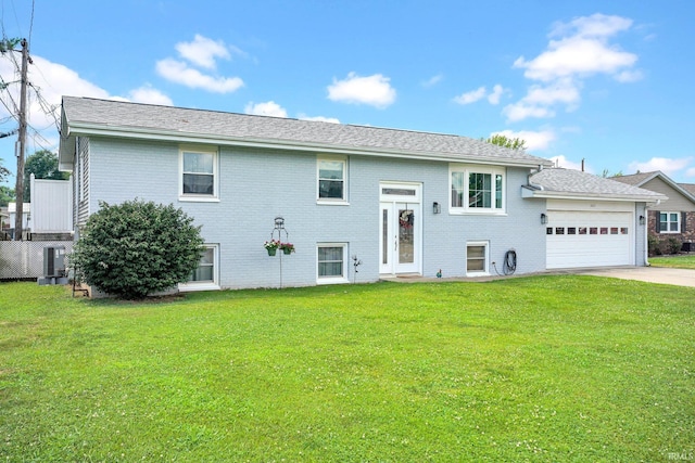 1803 Linwood Dr, Bedford, IN 47421 - view of front of property with brick siding, an attached garage, driveway, and a front lawn