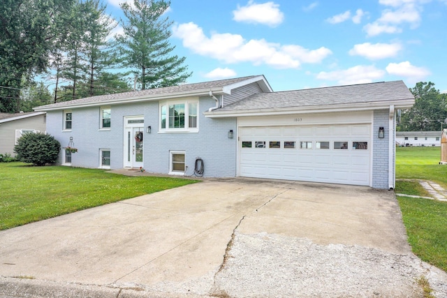 1803 Linwood Dr, Bedford, IN 47421 - bi-level home featuring brick siding, a front lawn, a garage, and driveway