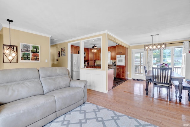 1803 Linwood Dr, Bedford, IN 47421 - living area featuring light wood-type flooring and crown molding
