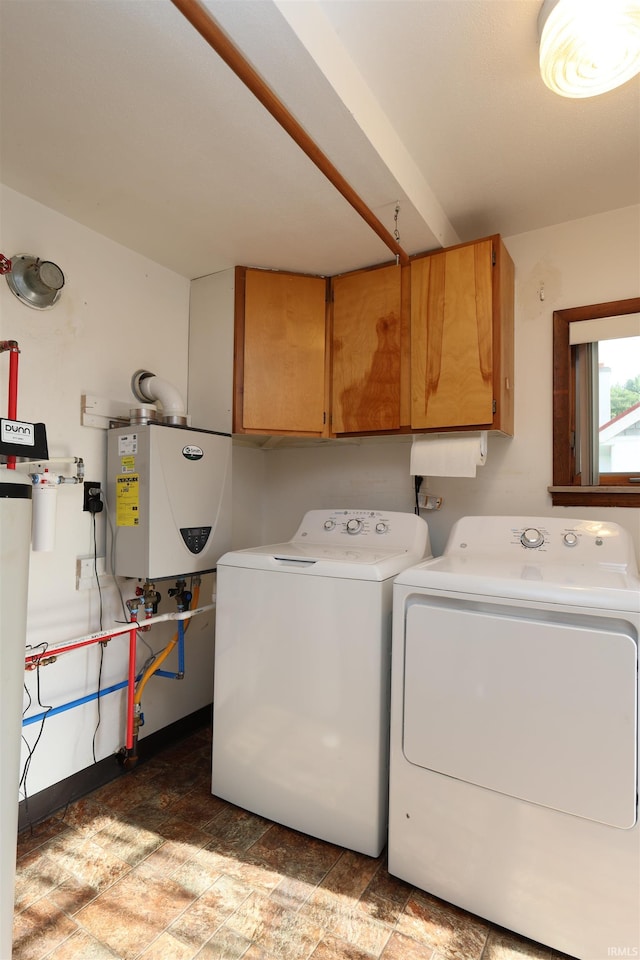 1765 E Old Kokomo Rd, Marion, IN 46953 - washroom with cabinet space, washing machine and clothes dryer, and tankless water heater