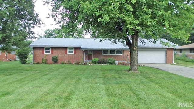716 Kimmell Rd, Vincennes, IN 47591 - ranch-style home with an attached garage, a front lawn, brick siding, and driveway