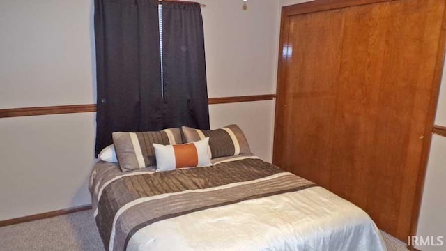 716 Kimmell Rd, Vincennes, IN 47591 - carpeted bedroom with baseboards and a closet