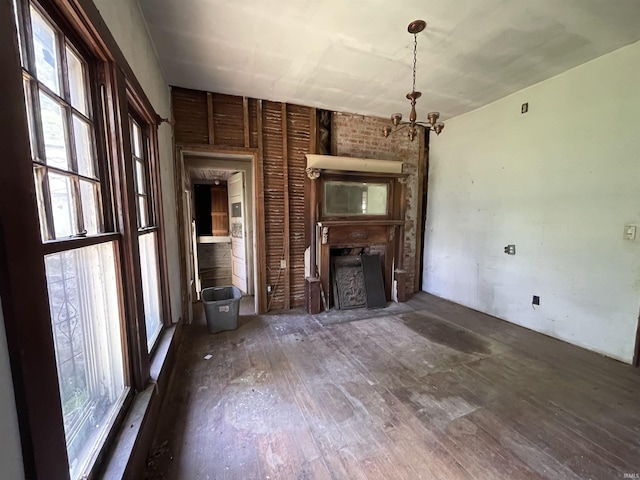 2812 Oliver Rd, Mount Vernon, IN 47620 - unfurnished living room with a chandelier, wood-type flooring, and a fireplace