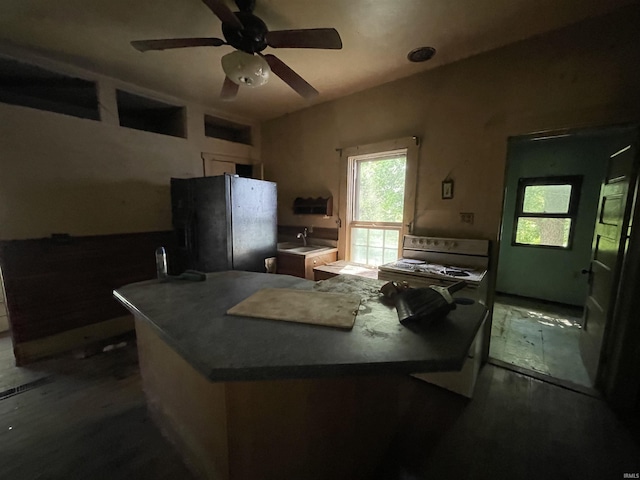2812 Oliver Rd, Mount Vernon, IN 47620 - kitchen featuring freestanding refrigerator, range, dark wood finished floors, and a ceiling fan