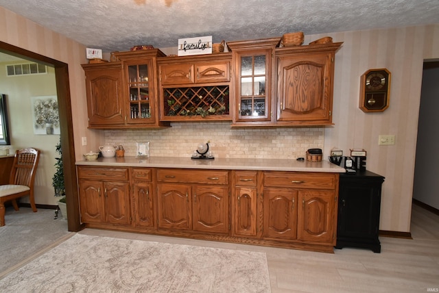 805 S James Ave, Fowler, IN 47944 - bar area featuring wallpapered walls, a textured ceiling, and decorative backsplash