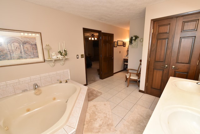 805 S James Ave, Fowler, IN 47944 - full bath with double vanity, a whirlpool tub, tile patterned flooring, a textured ceiling, and connected bathroom