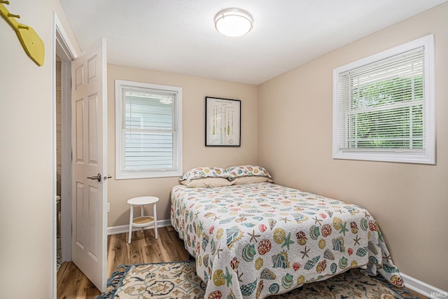 11685 W 710 N, Middlebury, IN 46540 - bedroom featuring wood finished floors and baseboards