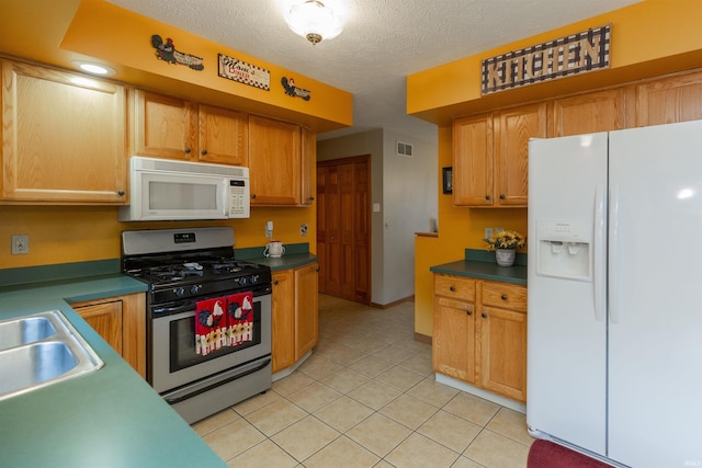 2233 Pine Creek Ct, South Bend, IN 46628 - kitchen featuring white appliances, light tile patterned flooring, and a textured ceiling
