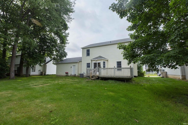 2233 Pine Creek Ct, South Bend, IN 46628 - back of property with a deck and a lawn