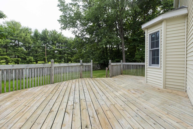 2233 Pine Creek Ct, South Bend, IN 46628 - wooden deck featuring view of wooded area and a yard