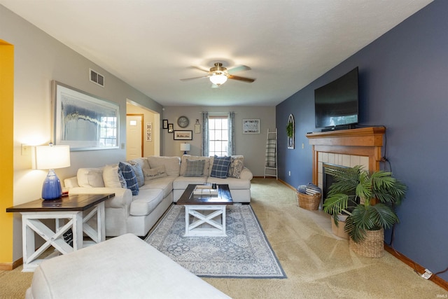 2233 Pine Creek Ct, South Bend, IN 46628 - living area with carpet, a ceiling fan, and a tiled fireplace