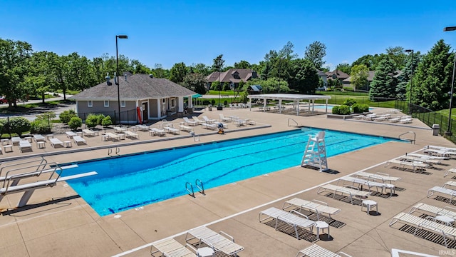 118 Royal Crest Dr, Fort Wayne, IN 46814 - community pool with a patio, a diving board, and view of wooded area