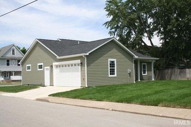 1001 E Clinton St, Frankfort, IN 46041 - view of property exterior with driveway, a garage, and roof with shingles