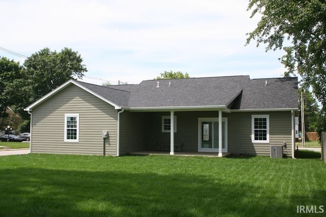 1001 E Clinton St, Frankfort, IN 46041 - view of front of property with a front lawn, a patio, and a shingled roof