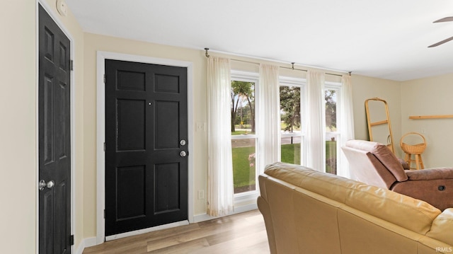 4144 Wenonah Ln, Fort Wayne, IN 46809 - entrance foyer with light wood finished floors and a ceiling fan