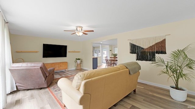 4144 Wenonah Ln, Fort Wayne, IN 46809 - living area with a ceiling fan and light wood-style floors