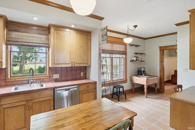 64052 State Road 331st Hwy, South Bend, IN 46614 - kitchen featuring stainless steel dishwasher, tile countertops, light tile patterned floors, ornamental molding, and tasteful backsplash