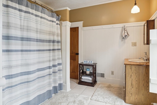 64052 State Road 331st Hwy, South Bend, IN 46614 - full bathroom with vanity, tile patterned floors, a wainscoted wall, ornamental molding, and curtained shower