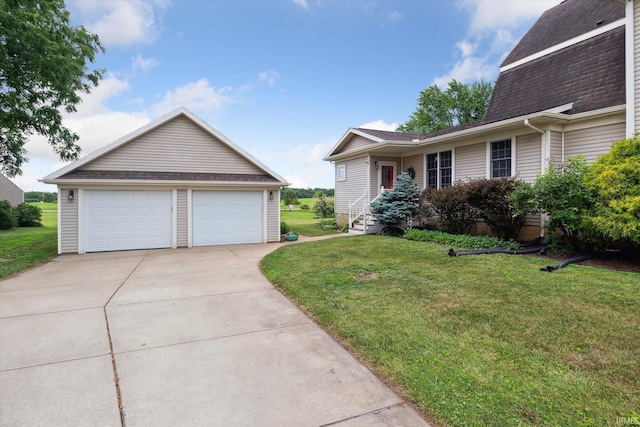 64052 State Road 331st Hwy, South Bend, IN 46614 - view of property exterior with a detached garage, roof with shingles, a yard, and an outbuilding