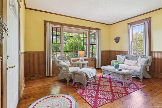 64052 State Road 331st Hwy, South Bend, IN 46614 - sitting room with wainscoting, plenty of natural light, wooden walls, wood-type flooring, and ornamental molding