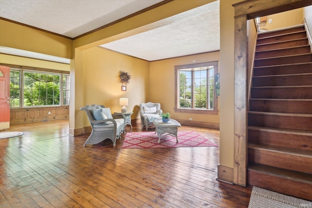64052 State Road 331st Hwy, South Bend, IN 46614 - sitting room featuring stairway, hardwood / wood-style floors, ornamental molding, and a textured ceiling