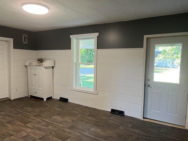 640 N Flint Rd, Angola, IN 46703 - foyer entrance with dark wood-type flooring, wainscoting, and wooden walls