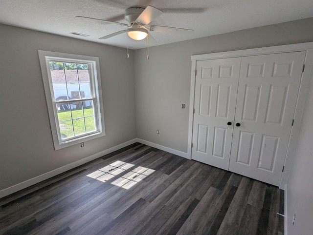 2206 24th Ave, Fort Wayne, IN 46802 - unfurnished bedroom with dark wood finished floors, a closet, and ceiling fan