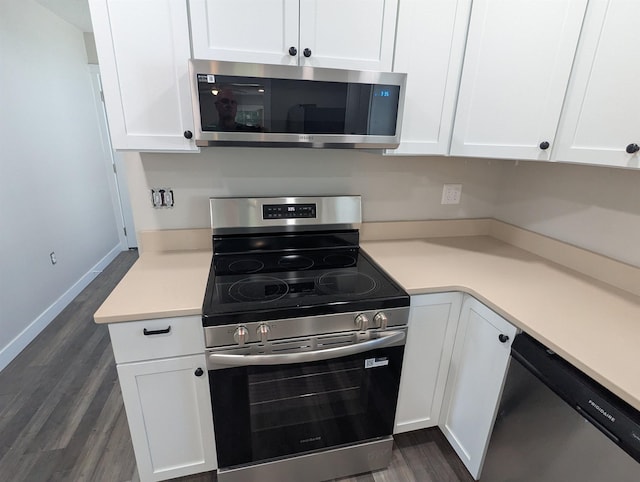 2206 24th Ave, Fort Wayne, IN 46802 - kitchen featuring appliances with stainless steel finishes, dark wood-style flooring, white cabinets, and light countertops