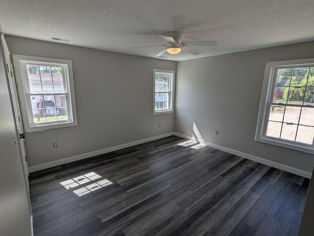 2206 24th Ave, Fort Wayne, IN 46802 - unfurnished room with dark wood-style floors, a textured ceiling, healthy amount of natural light, and ceiling fan