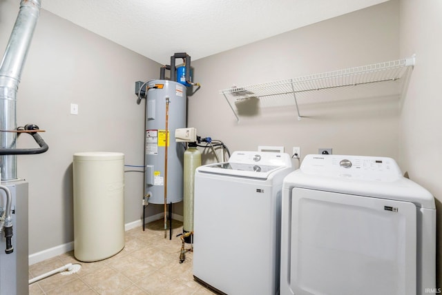 12216 Jacobas Pl, Fort Wayne, IN 46845 - laundry area with washing machine and dryer, electric water heater, and light tile patterned flooring