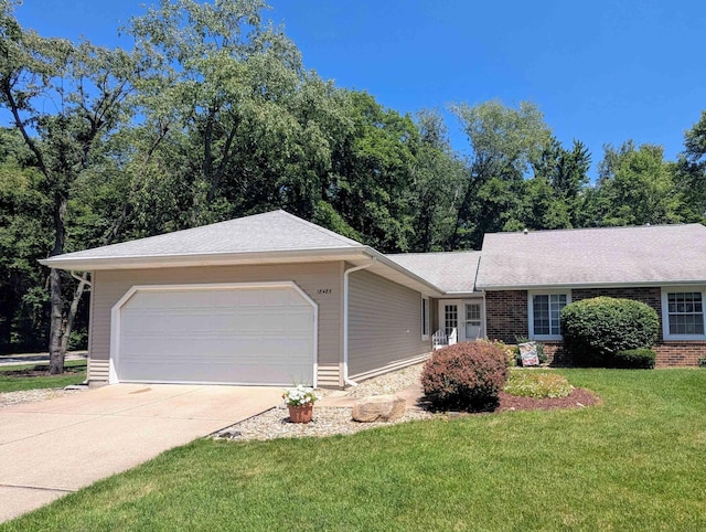 18485 Wooded Way S, Bend, IN 46637 - ranch-style house featuring an attached garage, driveway, a front yard, and brick siding