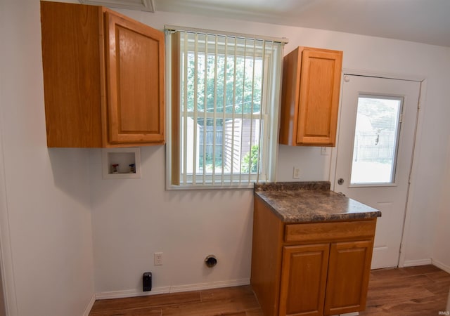 2625 S Ruston Ave, Evansville, IN 47714 - laundry area with washer hookup, plenty of natural light, cabinet space, and wood finished floors