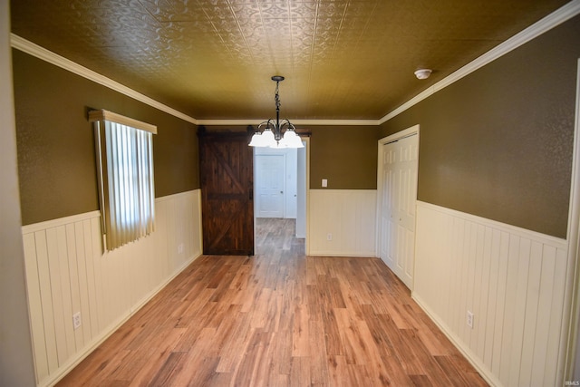 2625 S Ruston Ave, Evansville, IN 47714 - unfurnished dining area featuring wood finished floors, wainscoting, and a chandelier
