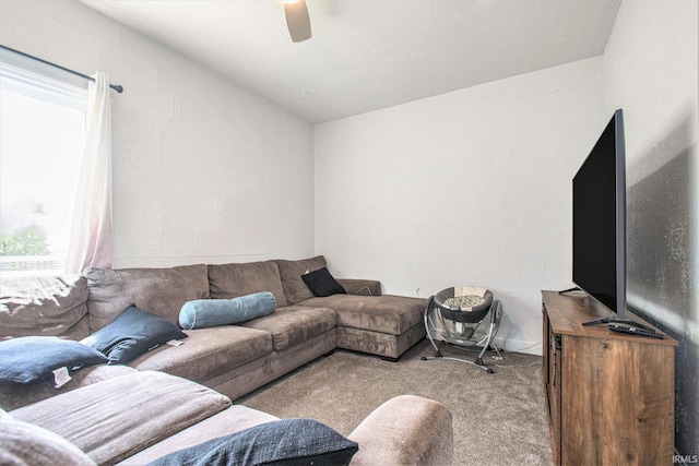 18055 Thomas Ln, Goshen, IN 46528 - carpeted living room with healthy amount of natural light, vaulted ceiling, and a ceiling fan