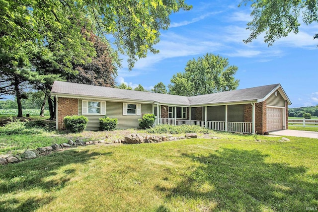 18055 Thomas Ln, Goshen, IN 46528 - single story home featuring brick siding, covered porch, an attached garage, and a front yard